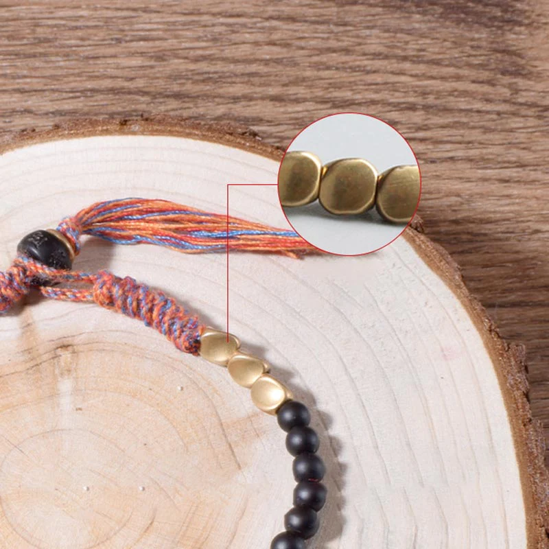 Braccialetto fatto a mano in onice nero tibetano con nappa Buddha Stones - Image 8