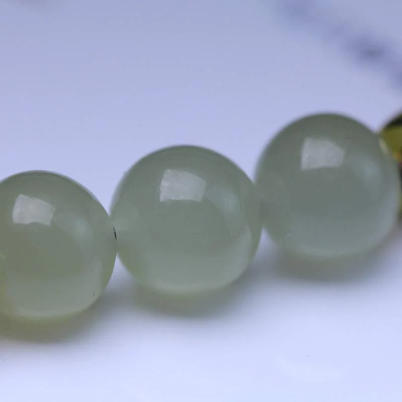 Braccialetto intrecciato con corda rossa in semi di loto di giada naturale Buddha Stones - Image 10